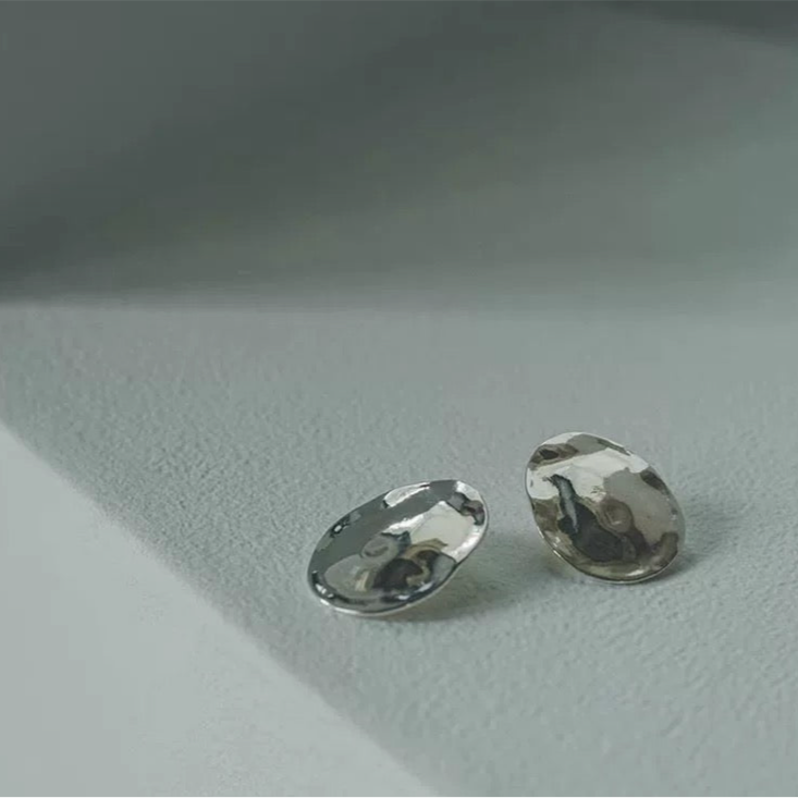 Lunar Melt Earrings – Fluid Elegance in Sculpted Metal