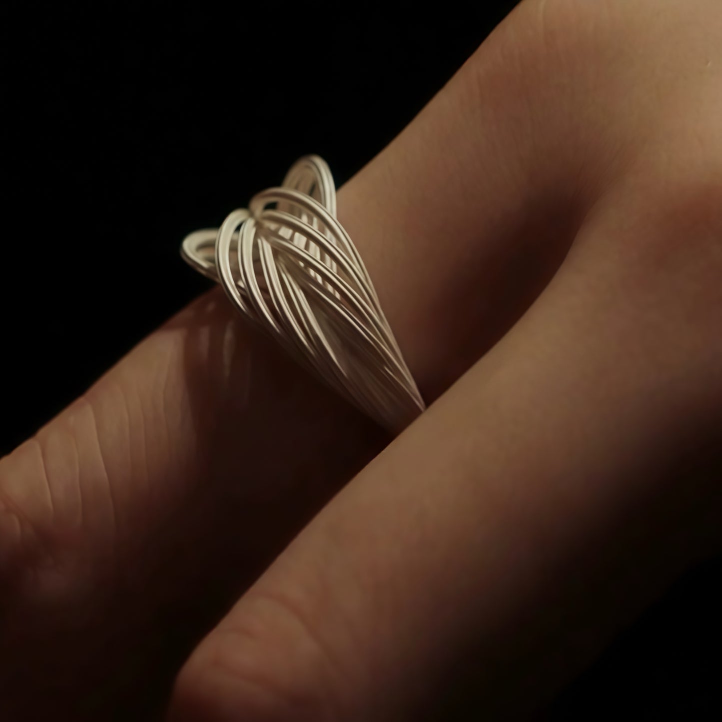 Interwoven Silver Statement Ring – Modern Sculptural Design