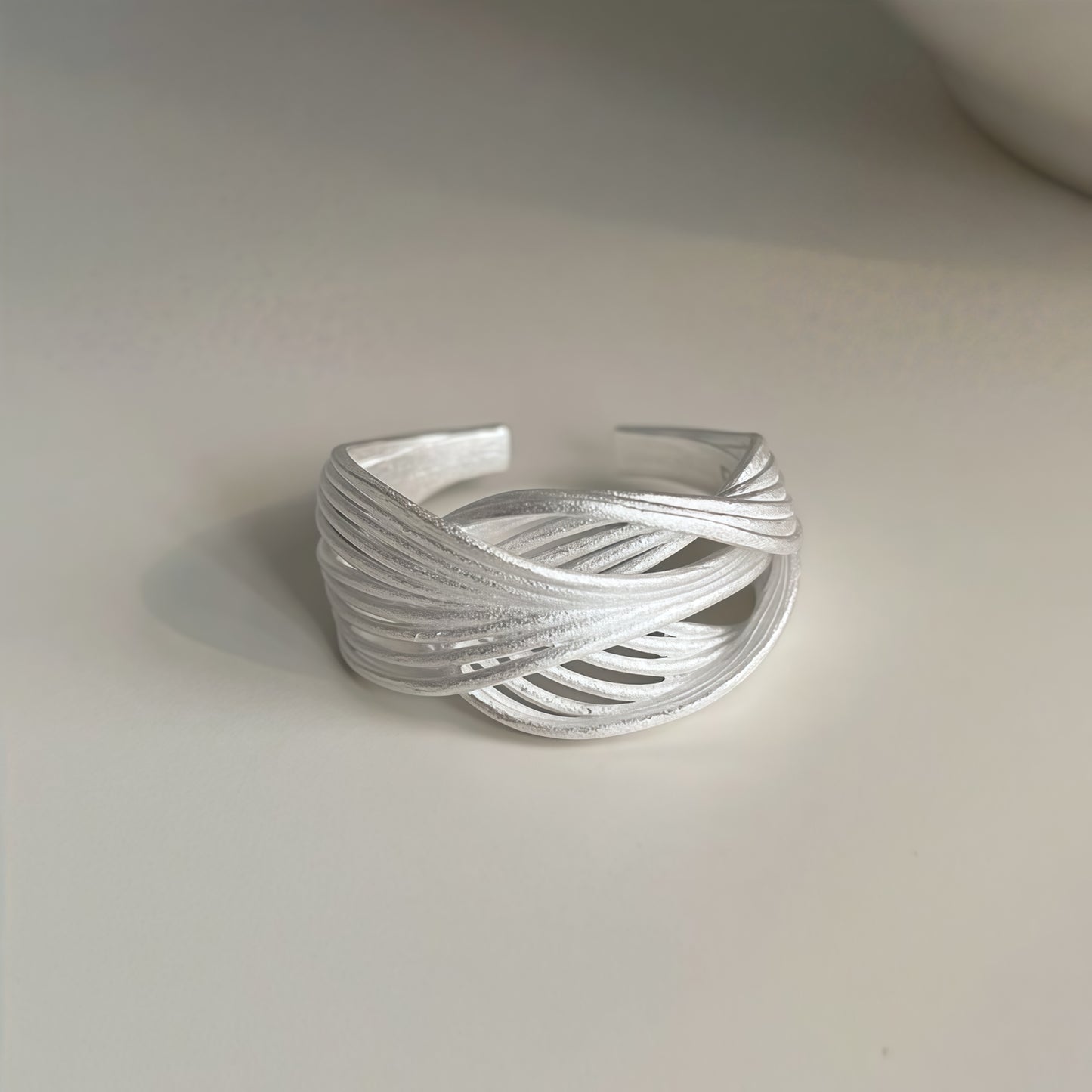 Interwoven Silver Statement Ring – Modern Sculptural Design